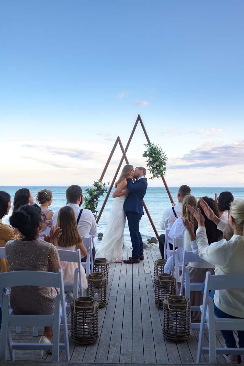 Bride and Groom share a wedding kiss in Cape Agulhas overlooking the Atlantic and Indian ocean at Marlin Manor